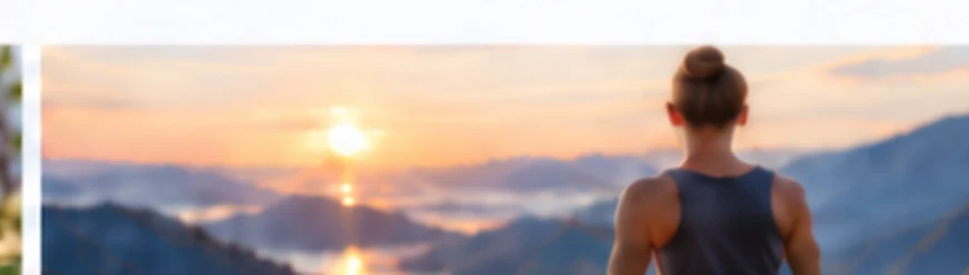 Woman sitting facing a mountain sunrise